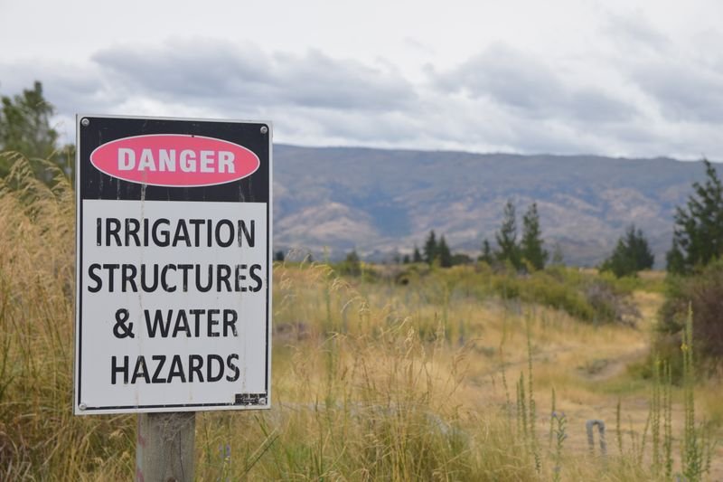A caution sign warning against a risky land purchase