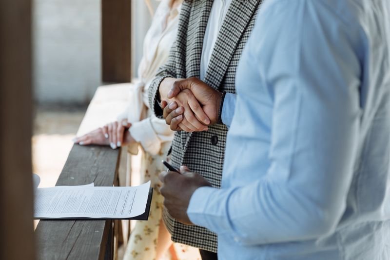 Buyer and seller signing a property agreement