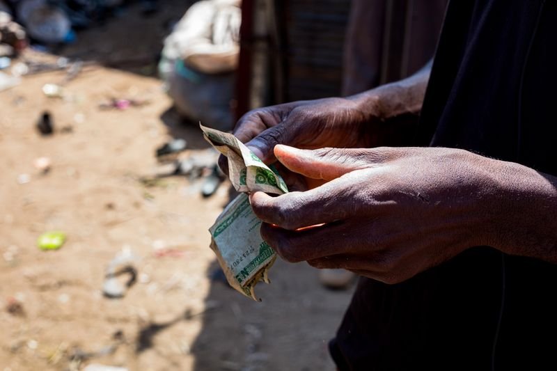 Cash changing hands under pressure