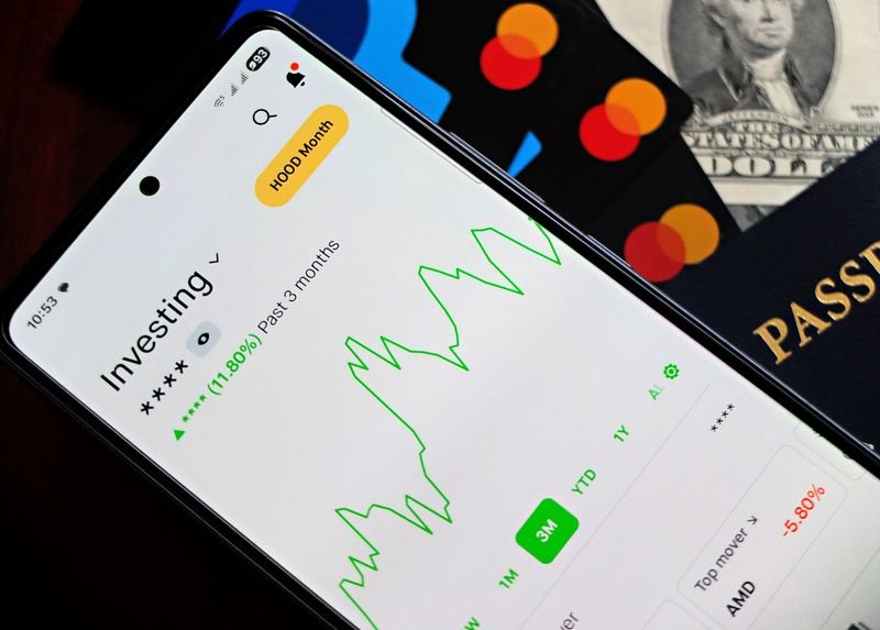 Investor checking an investment portfolio on a phone