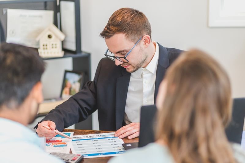 Agent explaining a payment plan to a client