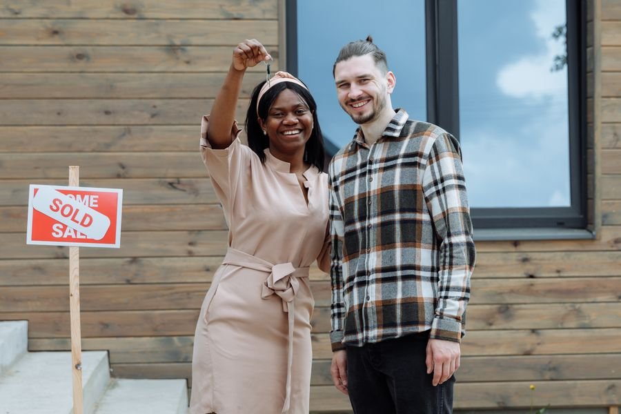A new homeowner holding keys to a house