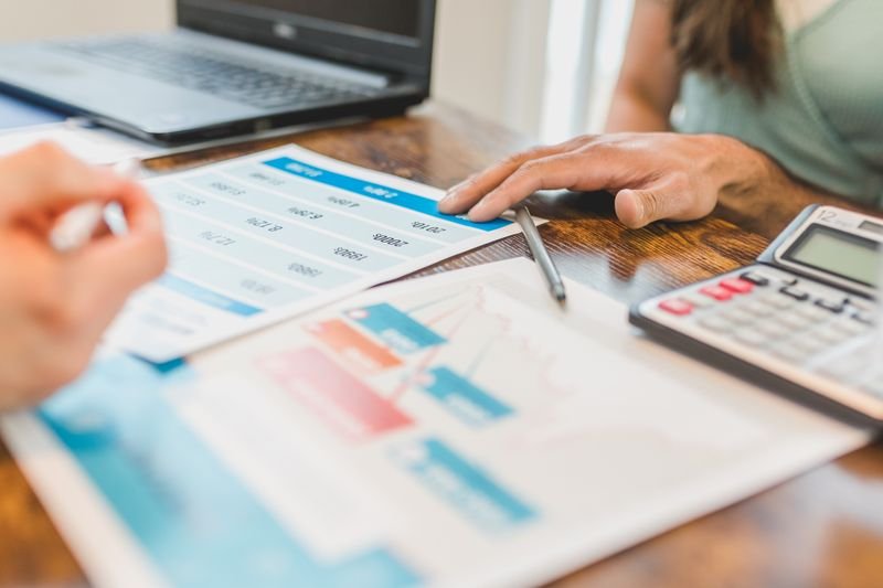 An owner reviewing property numbers before deciding